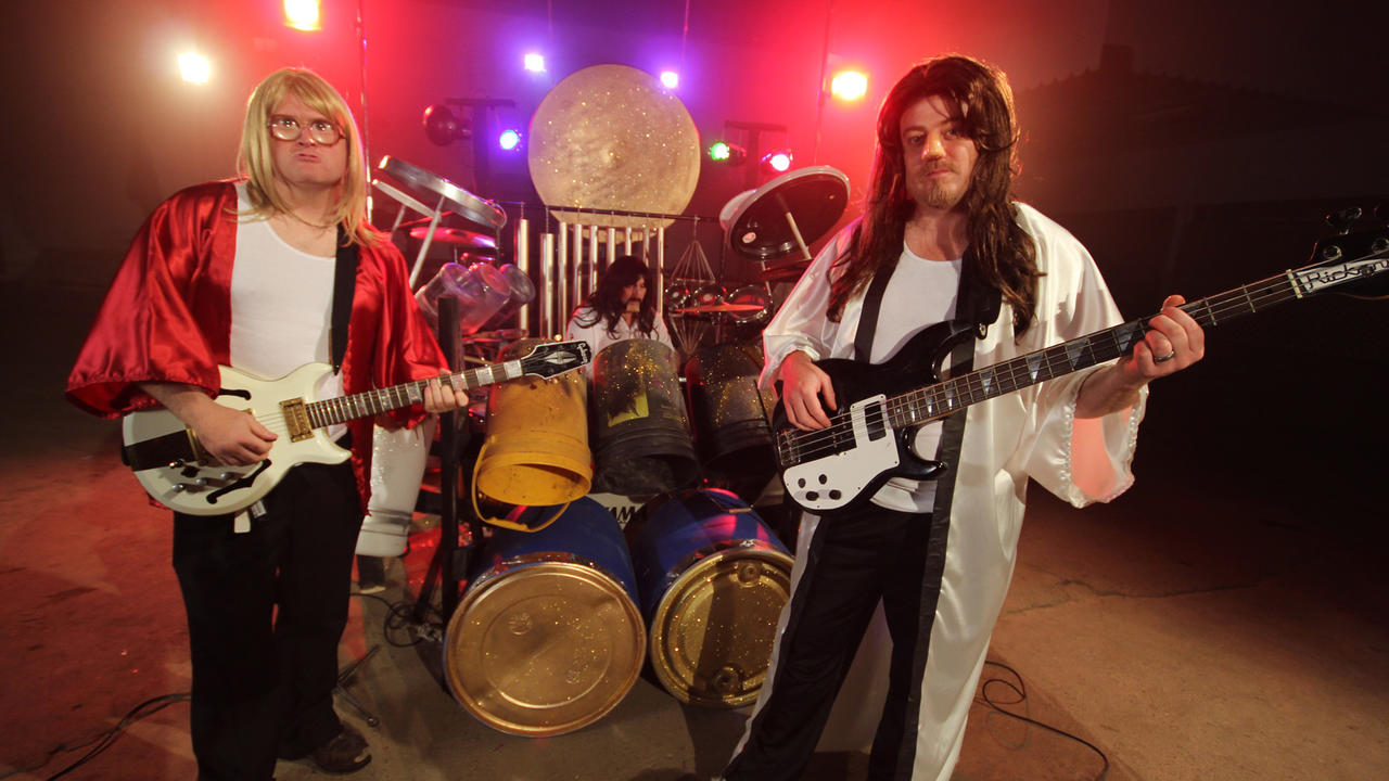 Alex Lifeson, Neil Peart, and Geddy Lee (it is totally them)